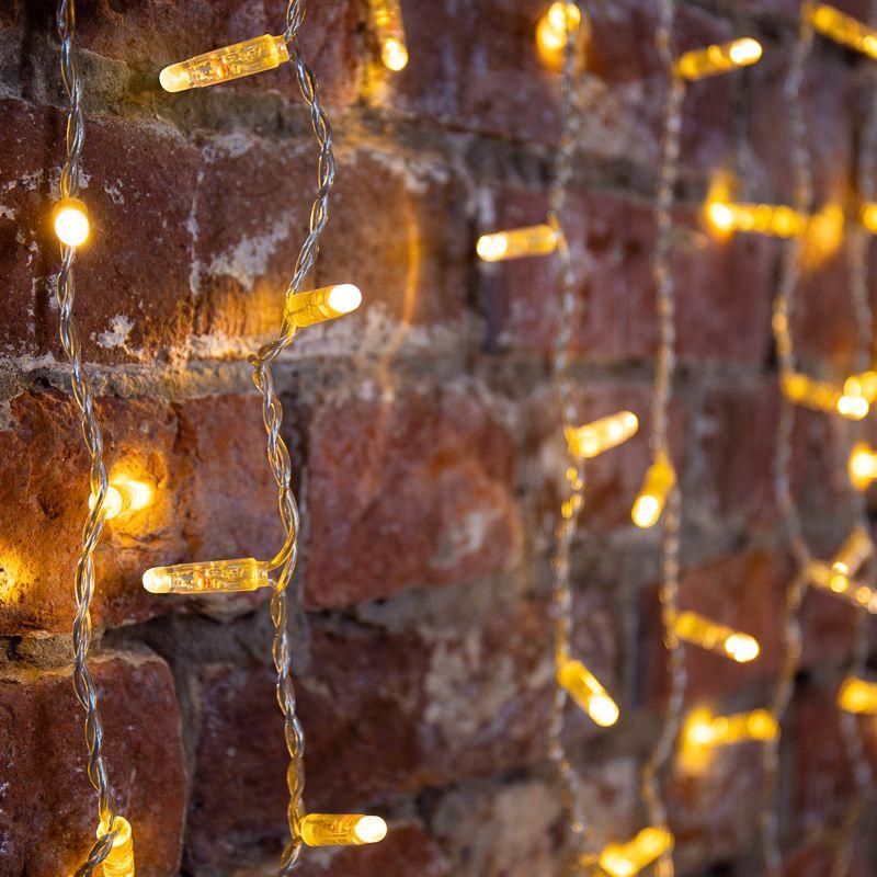 Гирлянда светодиодная "Светодиодный Дождь" 2х1.5м 192LED тепл. бел. 64Вт 230В IP65 эффект мерцания провод прозр. Neon-Night 235-316-6